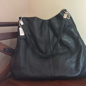 Large shoulder bag with plenty of room to hold everything you need.